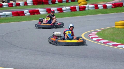 Two go carts round a bend at Phuket Kart, a popular attraction Video stock 61464735