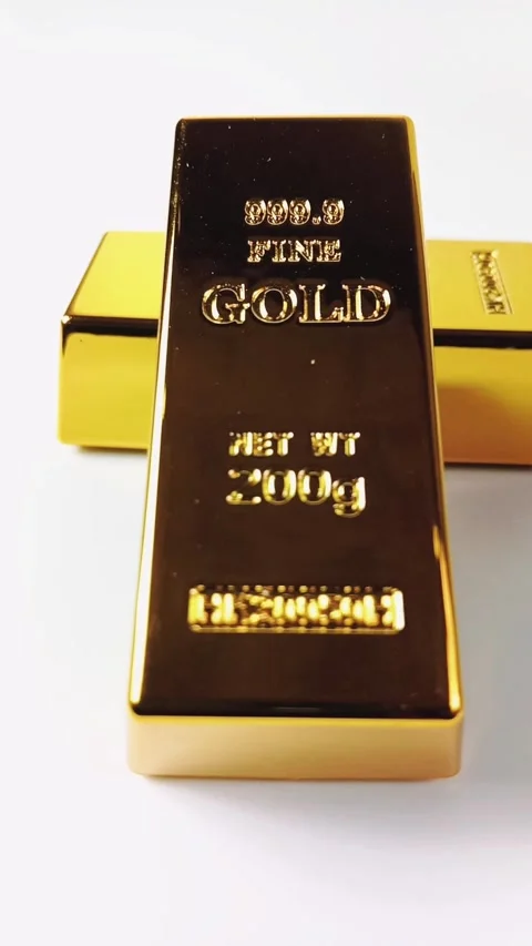 Two gold bars rotating on a white background Stock Footage 329080984
