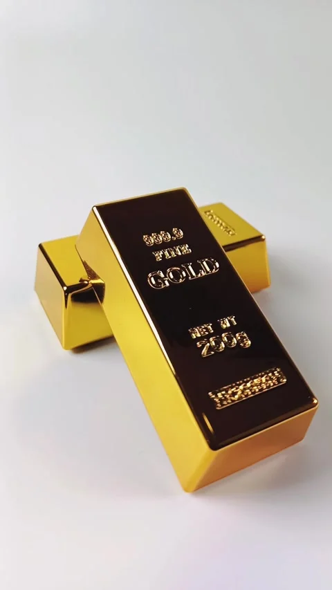 Two gold bars rotating on a white background Stock Footage 329081053