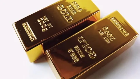 Two gold bars rotating on a white background Stock Footage 329081057