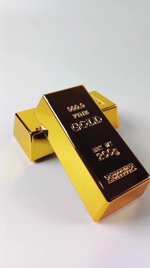 Two gold bars rotating on a white background Stock Footage 329081058