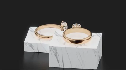 Two gold diamond rings rotating on black background from 3D animation design. 3d Stock Footage 272256270