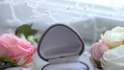 Two gold rings in a box for rings at the wedding Видео 123760063