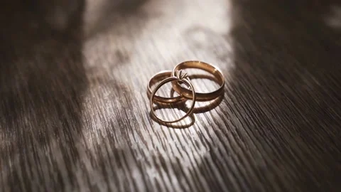 Two gold rings lie on the floor Stock Footage 172192559