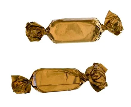 Two gold sweets close-up Stock Photos