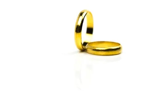 Two gold wedding ring isolated on white background with copy space, just add  Stock Photos