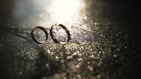 Two gold wedding rings Stock Footage 148074801
