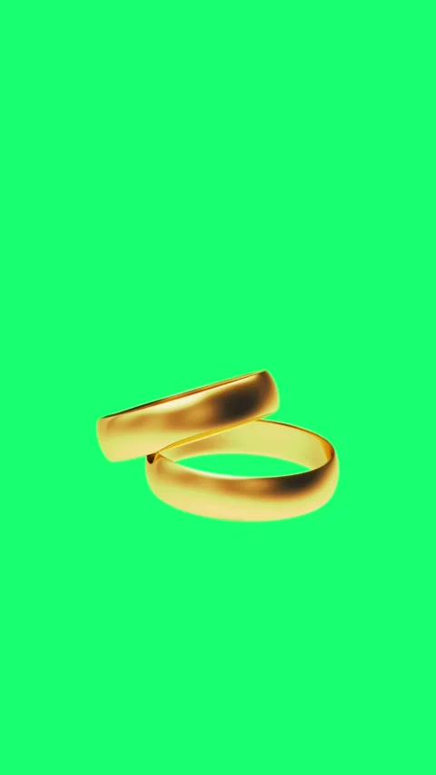 Two gold wedding rings spin on a green screen in 3D animation. Stock Footage 344058236