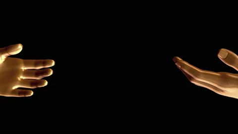 Two golden human hands reaching out to each other isolated on black background. Stock Footage 180880189