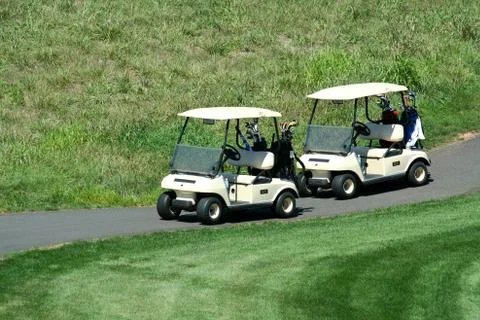 Two golf carts on the cart path Stock Photos