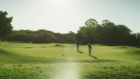 Two golf players during midday Stock Footage 264156561
