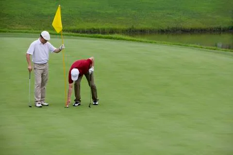 Two Golfers on the Green Stock Photos