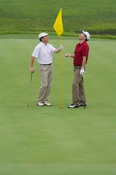 Two Golfers on the Green Stock Photos