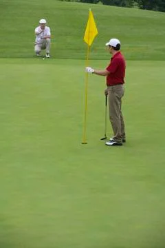 Two Golfers on the Green Stock Photos