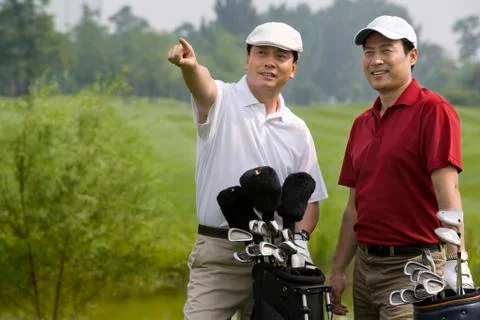 Two Golfers looking far front Stock Photos