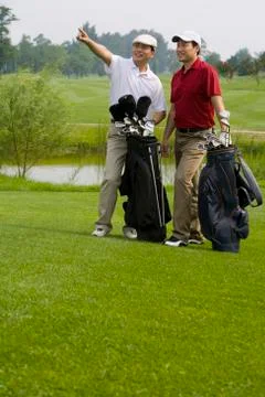 Two Golfers looking far front Stock Photos
