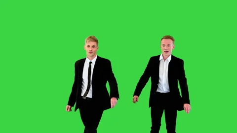 Two good-looking office workers perform charleston dance on a Green Screen Stock Footage 219473226