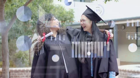 Two graduates celebrating on campus, holding diplomas and embracing while charts Stock Footage 333510290