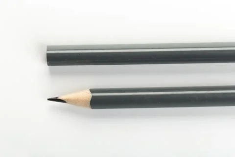Two gray graphite pencil triangular shape isolated.on white background Foto stock