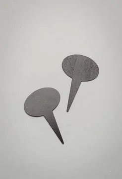 Two gray speech bubbles on white paper background Stock Photos