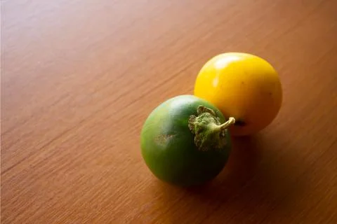 Two green and yellow sour eggplants placed Stock Photos
