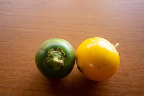 Two green and yellow sour eggplants placed Stock Photos