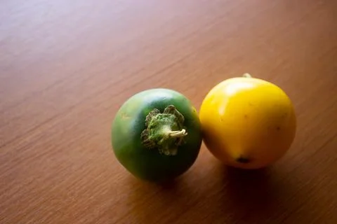 Two green and yellow sour eggplants placed Stock Photos