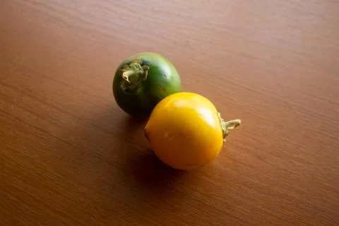 Two green and yellow sour eggplants placed Stock Photos