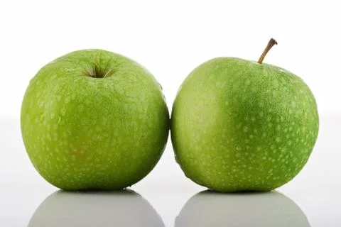 Two green apples Stock Photos
