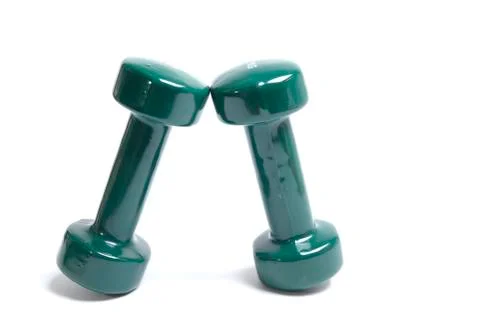 Two green dumbbells Stock Photos