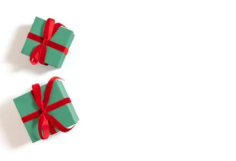 Two green gift boxes with red bows isolated on a white background  Stock Photos