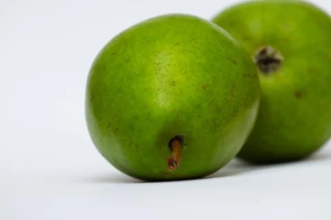 Two green pears lying on a light background close-up, Stock Photos