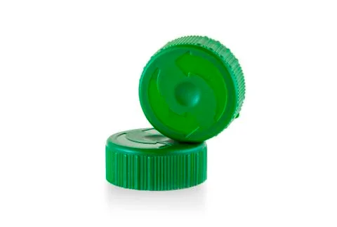 Two green plastic bottle caps Stock Photos