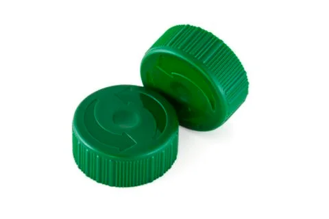 Two green plastic bottle caps Stock Photos