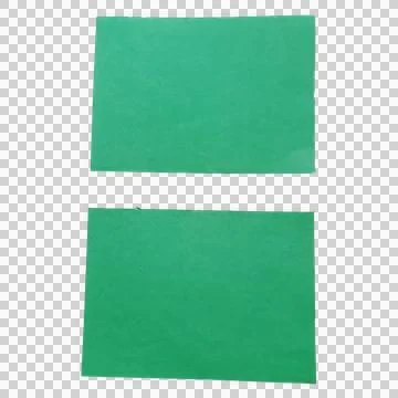 Two green rectangular paper sheets on a flat surface Фото
