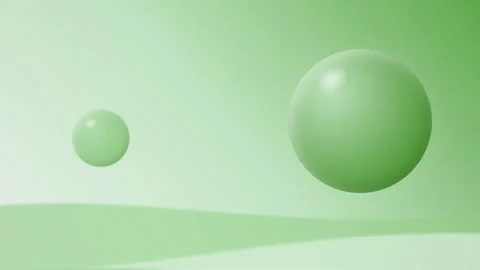 Two green spheres float gently in a seamless loop Stock Footage 341402216