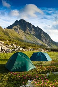 Two green tents in the mountains Stock Photos