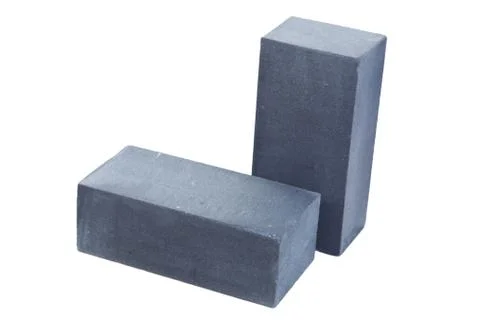Two grey ceramic bricks at the white background, isolated Stock Photos