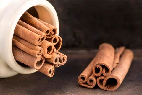Two groups of cinnamon sticks Stock Photos