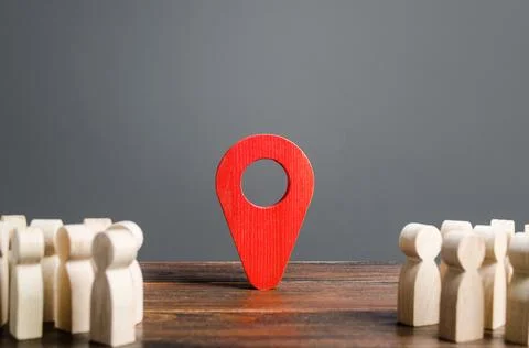Two groups of people are divided by a red location indicator. Meeting place.. Stock Photos