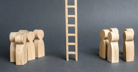 Two groups of people are separated by a career ladder. Promotion and career a 스톡 사진