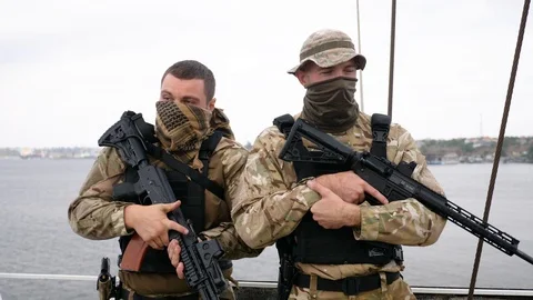 Two guards on the board of vessel patrolling port zone. Video stock 117250640