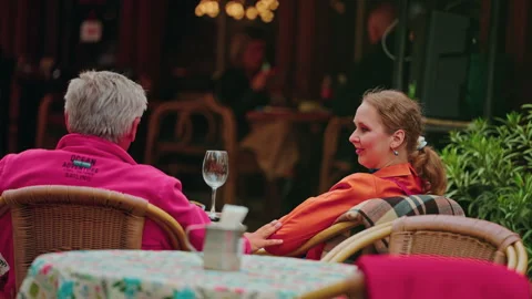 Two Guests At A Cafe Table Seen From Behind Stock Footage 346737150