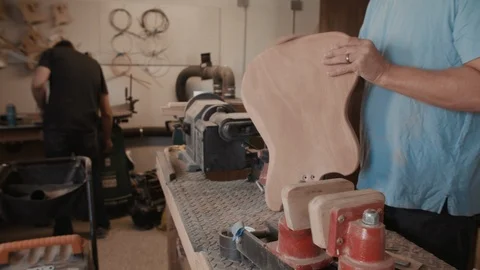 Two Guitar Builders Work in the Shop Stock Footage 126923137