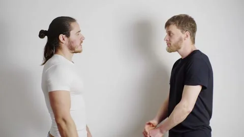 Two guy are quarreling, on a white background Stock-Footage 131056840