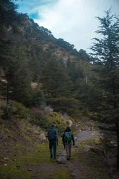 Two guy trekking into the forest of at ouabane Stock Photos