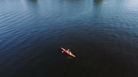 Two guys are canoeing on the river. Drone view 動画素材 160756376