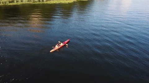 Two guys are canoeing on the river. Drone view Stock Footage 160756534