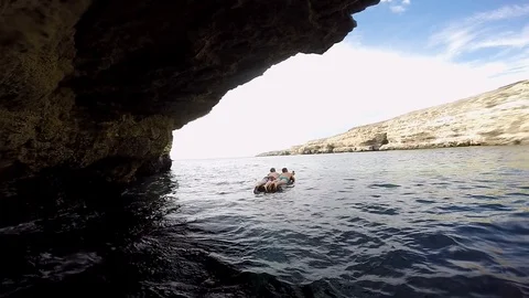 Two guys are lying on an inflatable mattress on the water Video stock 102019193