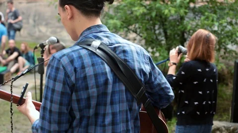 Two guys are playing and singing Stock Footage 121404161